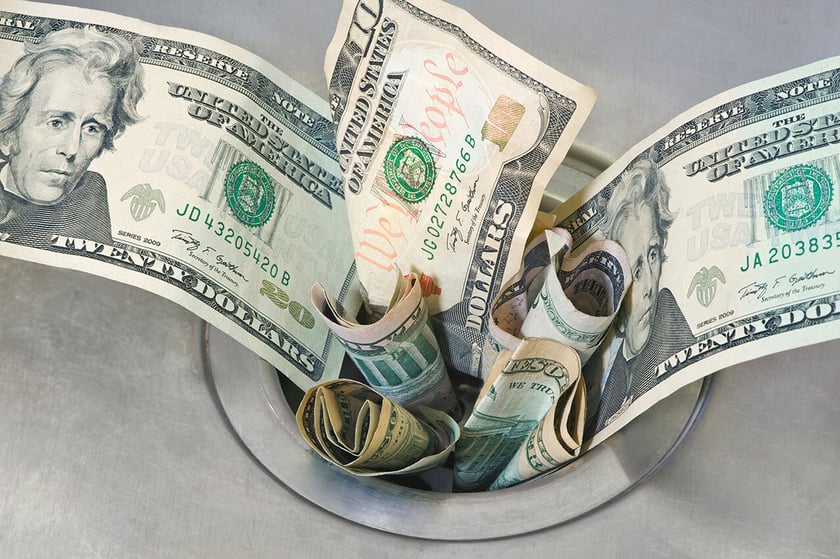 money down the drain - iStock-177718816 - 1277x850